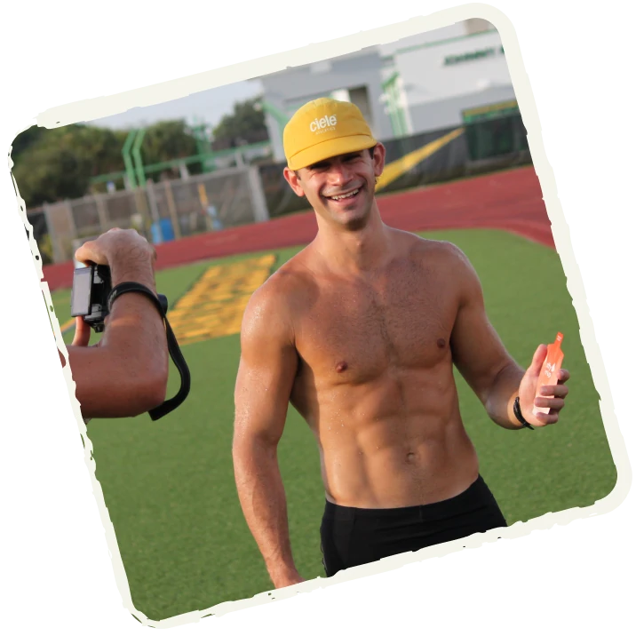 Two athletes laughing on the track