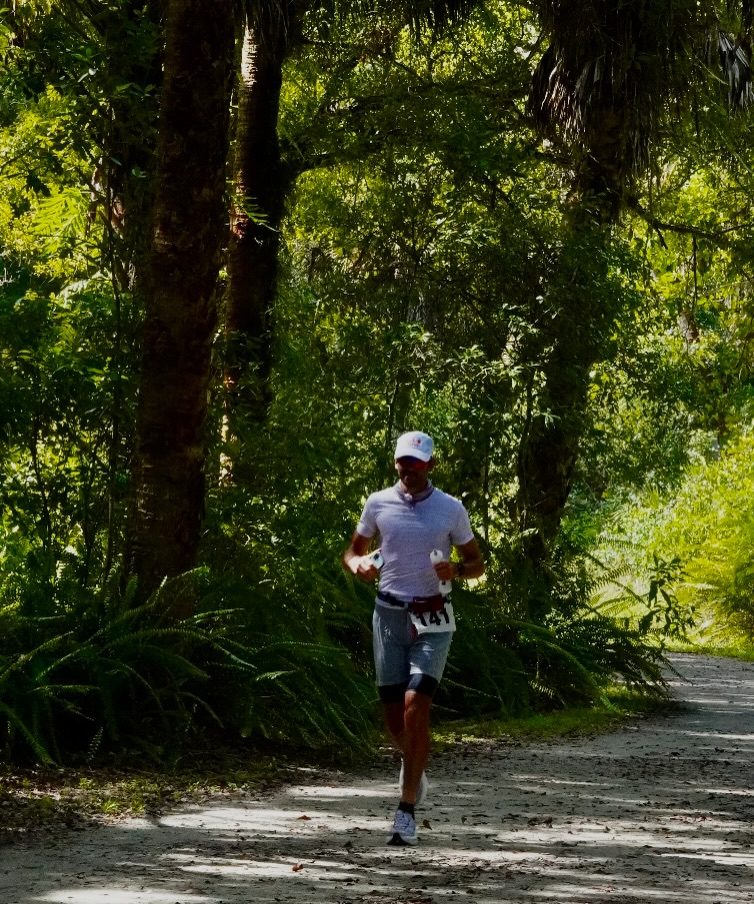 Conner Levin running a wooded trail at Riverbend Ultras 2026